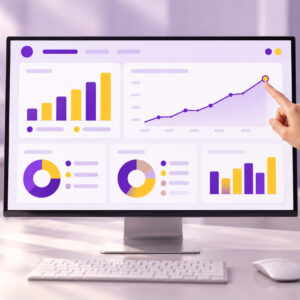 Owner pointing at a rising trend on a business dashboard